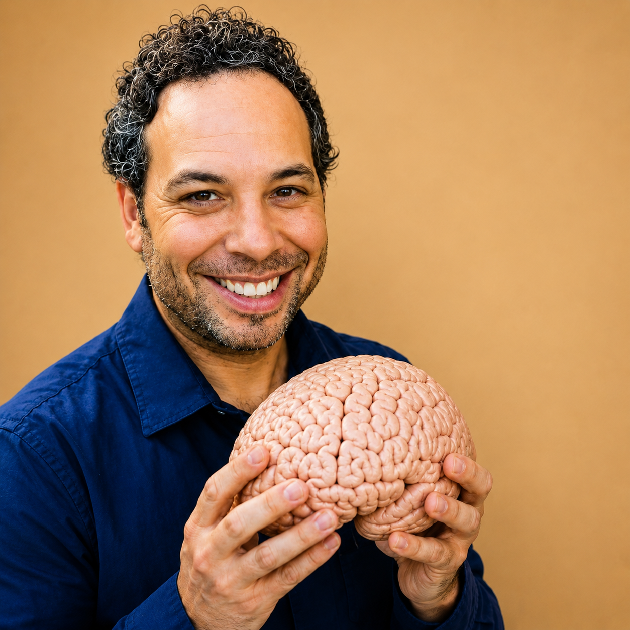 Dr. Steven Kushner holding a model brain